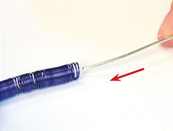 Wire being inserted into the coil